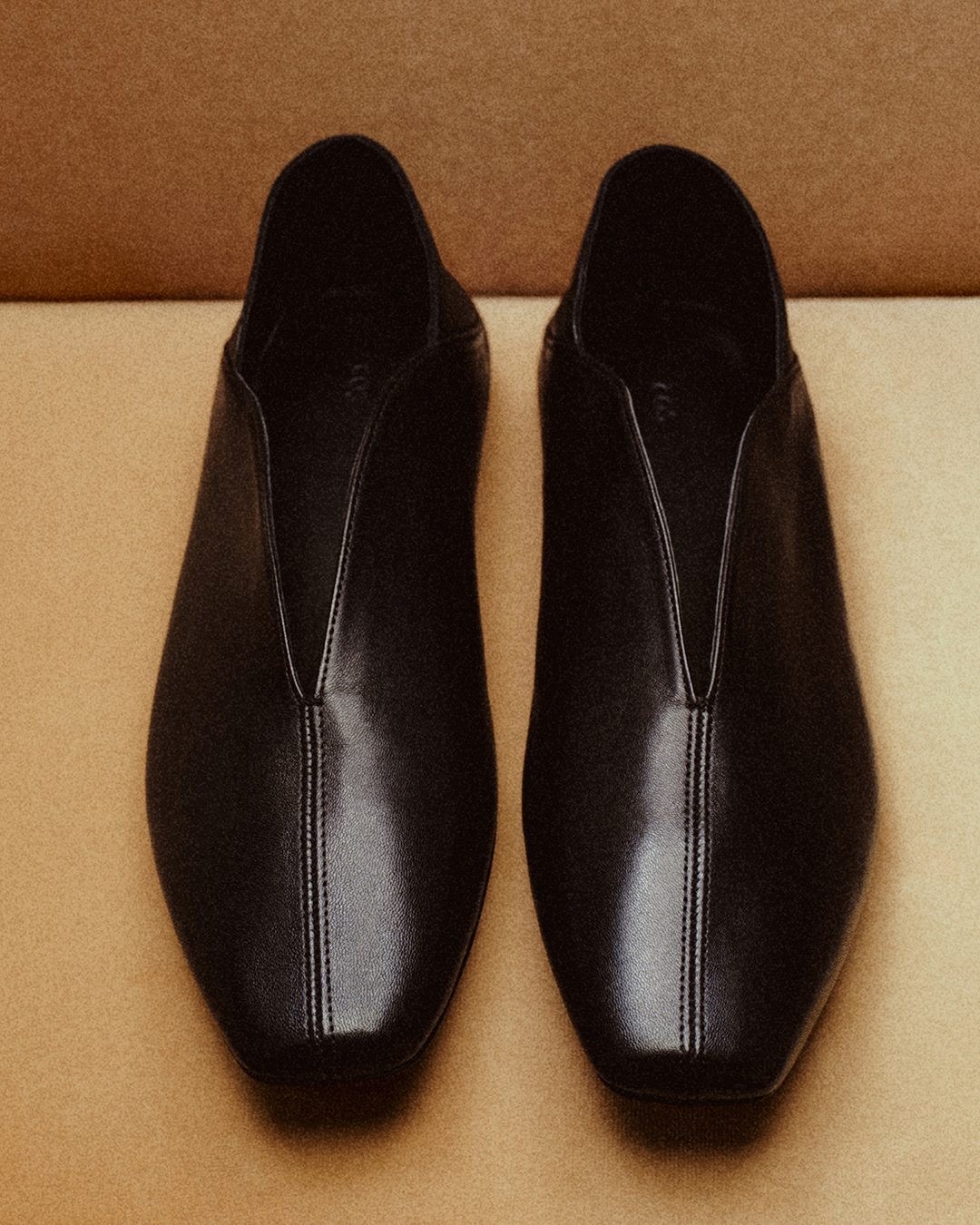 Lemaire black leather center-seam slip-on shoe on clean studio backdrop